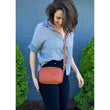 Load image into Gallery viewer, Siena bag on a woman in a blue shirt
